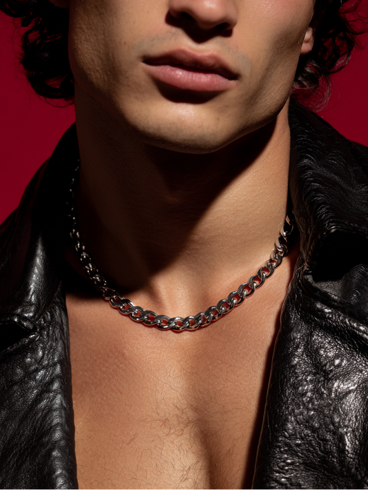 Ravion men’s sterling-silver Cuban chain, styled with a black leather jacket, red background